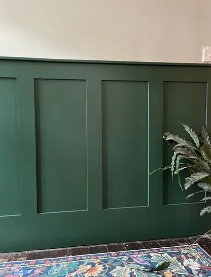 Hallway with green wall panelling