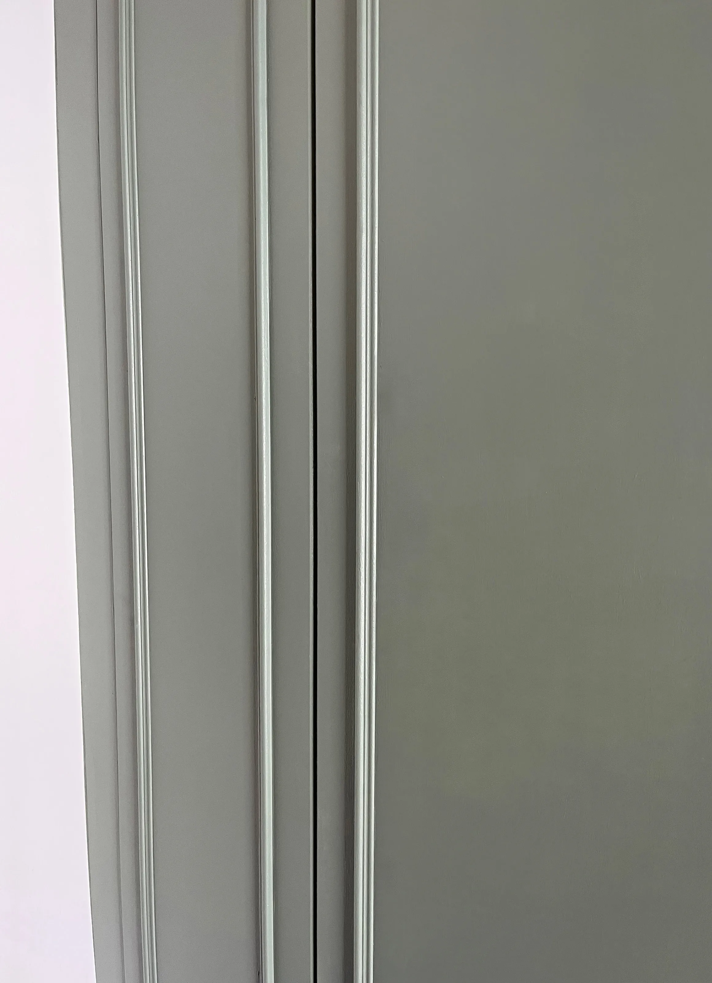 A close up of the moulding on built in wardrobe doors to give a victorian character to these built in units